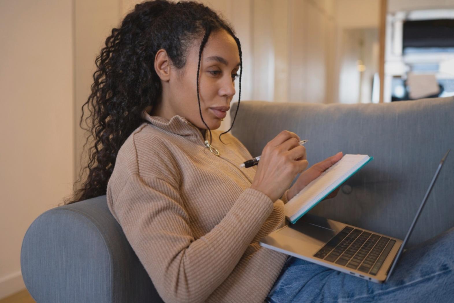 Person reviewing financial documents and planning budget strategies